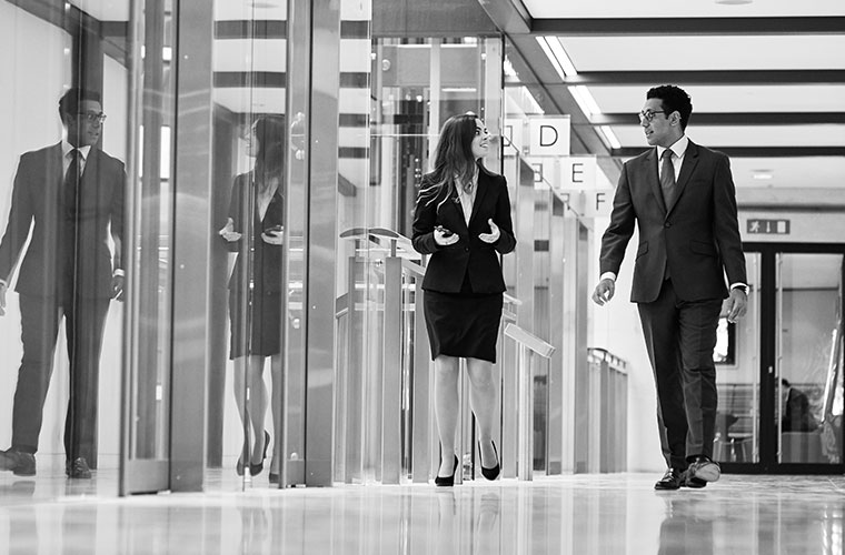 Man and woman walking in corridor